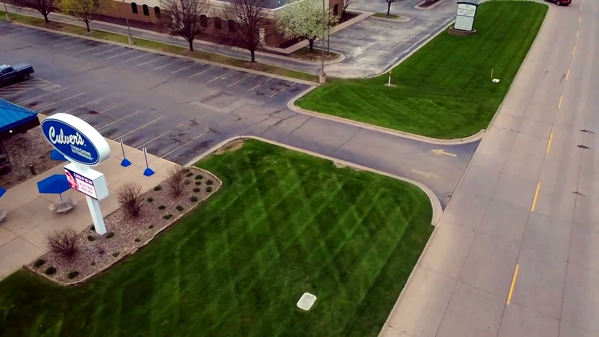 Aerial view of a professionally striped commercial lawn